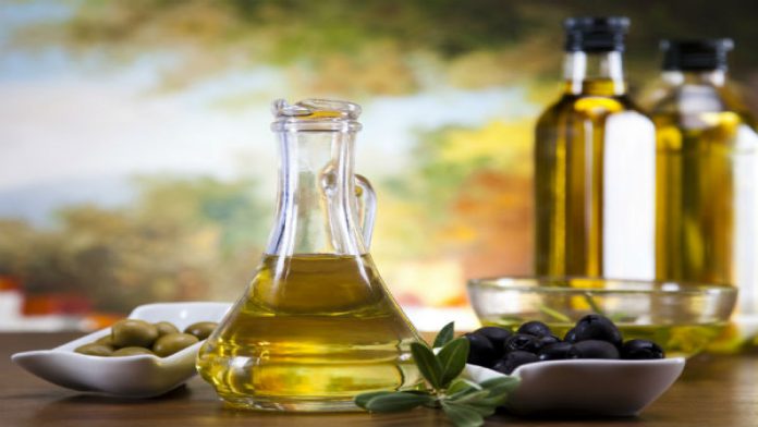 How long should olive oil be applied to the hair growth?